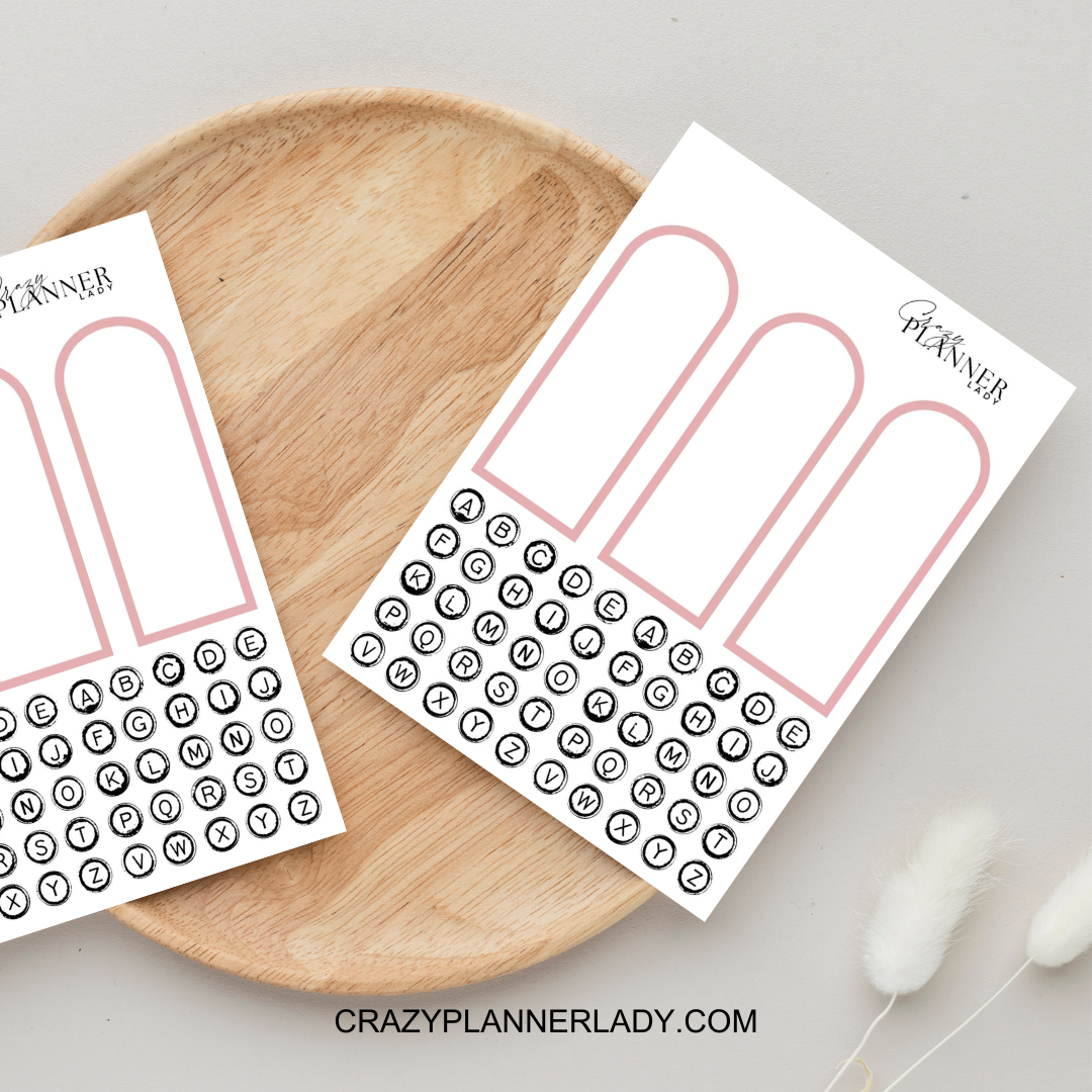 Neutral arch-shaped window sticker cutouts on white sheet